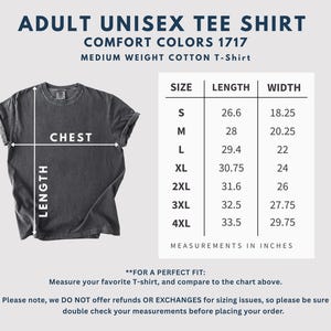 May include: A dark gray unisex t-shirt with a size chart. The chart provides measurements in inches for length and width, ranging from size small to 4XL. The text on the shirt reads "ADULT UNISEX TEE SHIRT" and "COMFORT COLORS 1717".
