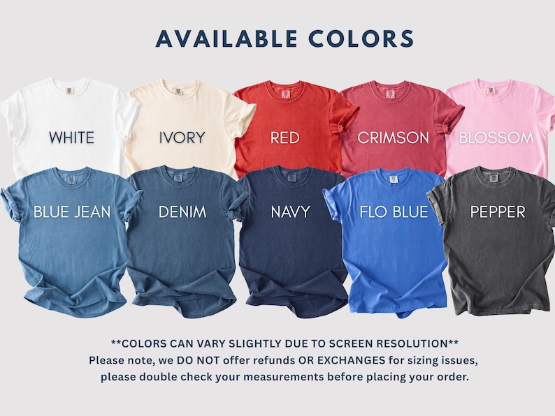 May include: A display of t-shirts in various colors, including white, ivory, red, crimson, blossom, blue jean, denim, navy, flo blue, and pepper. Each shirt has a crew neck and short sleeves. The text "AVAILABLE COLORS" is at the top.