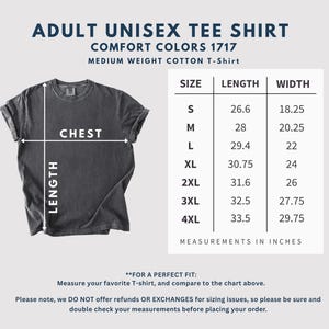 May include: A dark gray unisex t-shirt with the text "ADULT UNISEX TEE SHIRT" and a size chart with measurements in inches. The shirt is displayed with chest and length measurements. The chart includes sizes S to 4XL.
