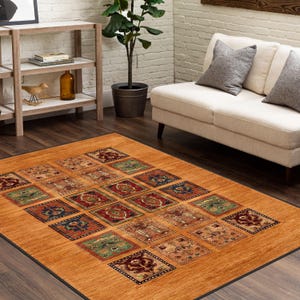 May include: A patterned area rug with a brown background and a geometric design in shades of red, blue, green, and beige. The rug is laid out on a hardwood floor in a living room setting.