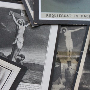 May include: A collection of black and white religious cards featuring images of Jesus Christ on the cross. The cards have a vintage feel and are printed with the text "REQUIESCAT IN PACE".