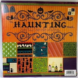 May include: A square paper pad titled The Haunting Stack featuring 48 sheets of 12 inch by 12 inch printed cardstock. The cover displays orange and black Halloween patterns including skulls, ghosts, cats, bats, and potion bottles.
