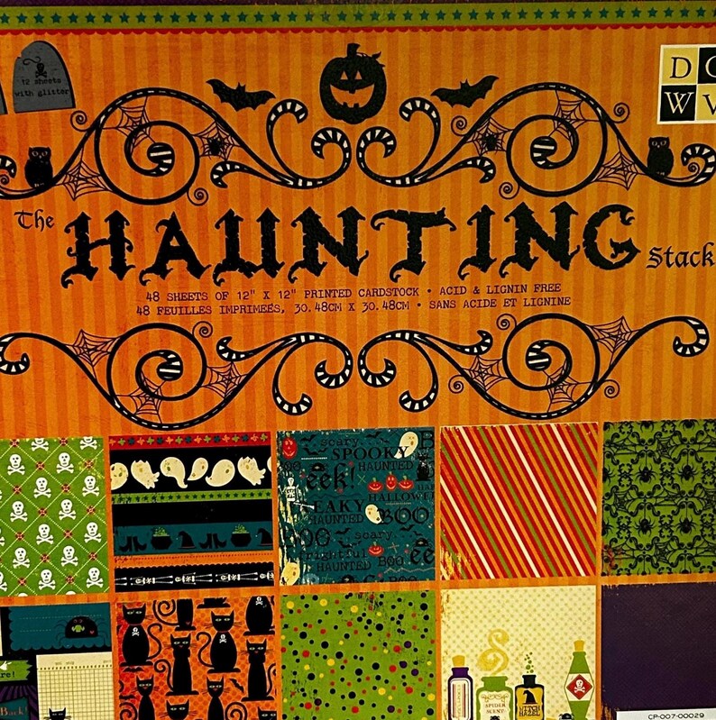 May include: A paper craft stack titled The Haunting Stack, containing 48 sheets of 12 inch by 12 inch printed cardstock. The cover features orange and black Halloween graphics including pumpkins, bats, and spiders, with various patterned paper samples displayed below.