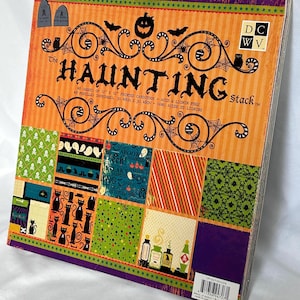 May include: A square paper pad titled The Haunting Stack featuring 48 sheets of 12 x 12 inch printed cardstock. The cover displays orange, purple, green, and black Halloween patterns including pumpkins, bats, cats, ghosts, and skulls.