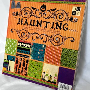 May include: A square stack of 48 sheets of 12 inch by 12 inch printed cardstock titled The Haunting Stack. The cover features orange and purple stripes, black silhouettes of pumpkins, bats, and cats, and various Halloween-themed patterns.