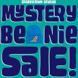 May include: A promotional graphic for Sparkletown Studios. It features a blue beanie with an orange dinosaur graphic. The text "MYSTERY BEANIE SALE!" is displayed in large, bold letters. The background is teal and dark blue.