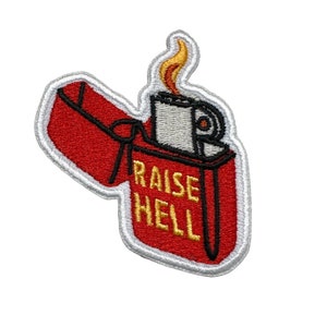 May include: Red and white embroidered patch of a lighter with a flame and the text "RAISE HELL" in gold.