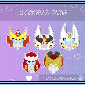 May include: Five colorful acrylic pins featuring robot face designs. The pins showcase a variety of colors, including red, yellow, white, and blue. The text "ACRYLIC PINS" is displayed at the top of the image.