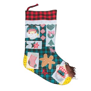 May include: A handmade Christmas stocking with a plaid pattern in red and green. The stocking features various appliqued designs, including a Santa Claus, stars, a Christmas tree, and gingerbread people. The top is trimmed with white lace and red plaid fabric.