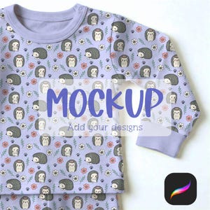 May include: A light purple long-sleeved shirt with a repeating pattern of cartoon hedgehogs, flowers, and paw prints. The word "MOCKUP" is overlaid on the shirt, with "Add your designs" below. The shirt has a round neckline and ribbed cuffs.
