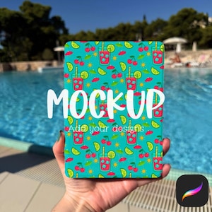 May include: A teal tablet case featuring a repeating pattern of red cocktail glasses, cherries, lime slices, and small red umbrellas. The word "MOCKUP" is displayed in white, with "Add your designs" below.