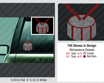May include: A rhinestone drum design with red and crystal stones. The design is 5.53 inches tall and 5.11 inches wide. The design includes 504 crystal stones and 241 red stones.
