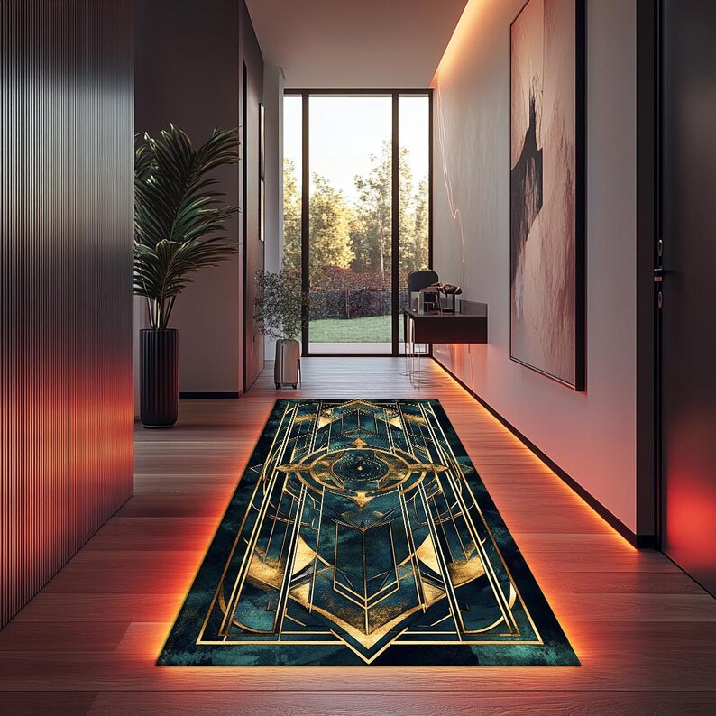 May include: A geometric patterned rug with gold and teal accents. The rug is laid out in a hallway with warm orange lighting.