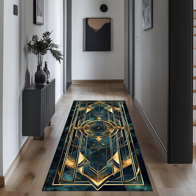 May include: A teal and gold geometric patterned rug with a modern design. The rug has a rectangular shape and is placed in a hallway.