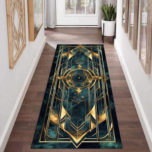 May include: A teal and gold geometric patterned runner rug with a central circular design. The rug has a modern, art deco style.