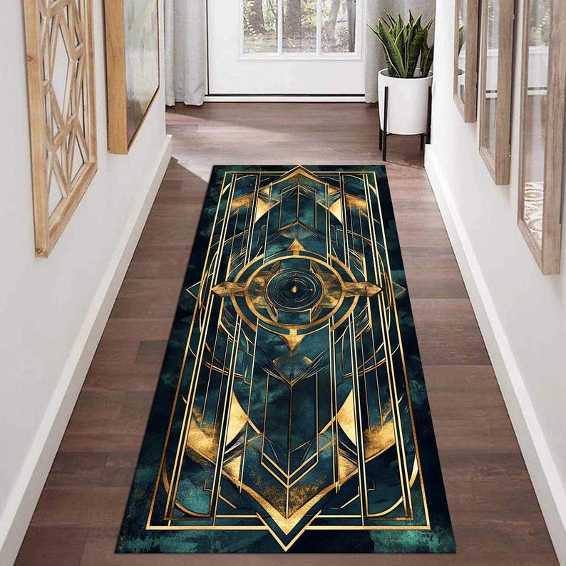 May include: A teal and gold geometric patterned runner rug with a central circular design. The rug has a modern, art deco style.