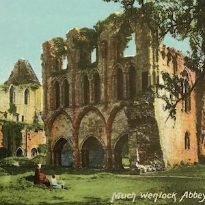 May include: A vintage postcard featuring a colorized illustration of the stone ruins of Much Wenlock Abbey. The scene depicts weathered arches and walls set against a green landscape with trees, including the printed text Much Wenlock Abbey.