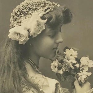 Antique 1900s Postcard – Elegant Young Woman with Flowers – Edwardian Beauty