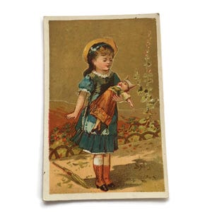 Antica carta commerciale francese – Ragazza con bambola, parasole, scena di giardino, effimera vittoriana