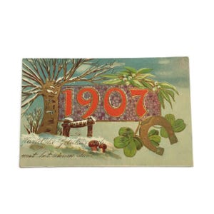 Carte postale ancienne du Nouvel An de 1907 – gaufrée et illustrée en néerlandais