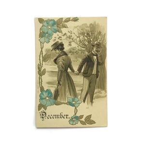 Antieke ansichtkaart december - Victoriaans stel - winters tafereel met reliëf - vintage ansichtkaart jaren 1900