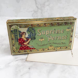 Klein antiek Frans Suprême Pernot blikje – Art Nouveau koekjesdoos, hulstrand