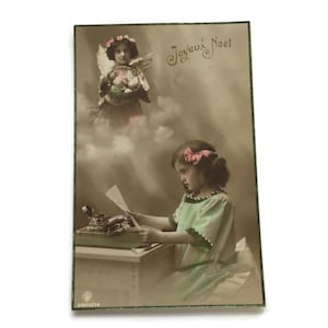 Antique French Postcard – Joyeux Noël Christmas Scene with Angel and Child Writing Letter (1915)
