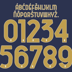 May include: A dark blue background featuring a gold-coloured alphabet from A to Z with diacritics and the numbers 0 through 9. Each number includes a small white lion icon at the base. The font is a bold, sans-serif style with a thin white outline.