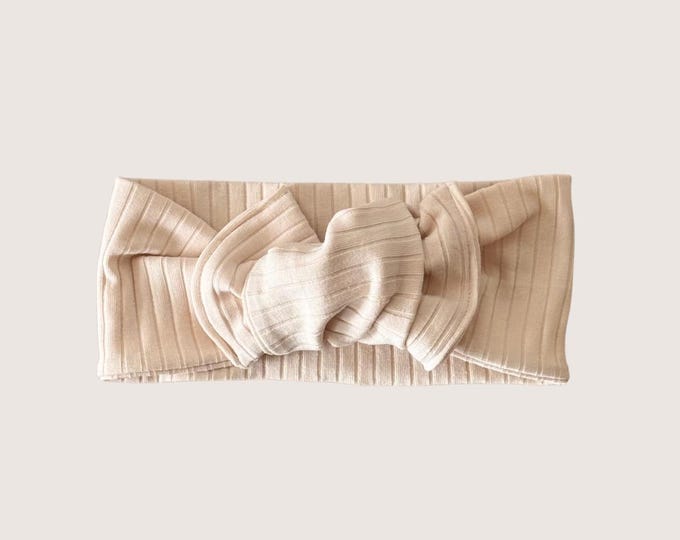 Featured listing image: Pannebånd med sløyfe i bred bomullsribb - Krem