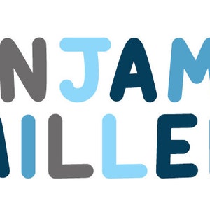 May include: A blue, gray, and white name sign with the text "BENJAMIN MILLER" in a playful, rounded font.