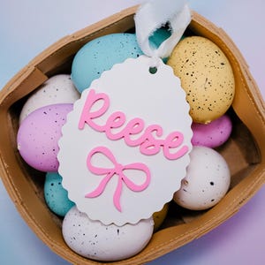 Étiquettes roses pour panier de Pâques, étiquette de panier de Pâques personnalisée pour fille, étiquette de panier de Pâques personnalisée, étiquette en forme d'oeuf avec noeud rose, décoration printanière de Pâques