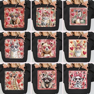 Può includere: Felpe nere con grafiche di animali, tra cui una mucca, un gatto, un'oca, un lama, un orso, un coniglio, una giraffa, un procione e un dalmata. Ogni animale indossa occhiali da sole e fiocchi a forma di cuore, circondati da cuori.