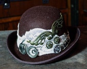 steampunk mini bowler derby hat, brown and cream fascinator, with cogs and clock parts, the engineer