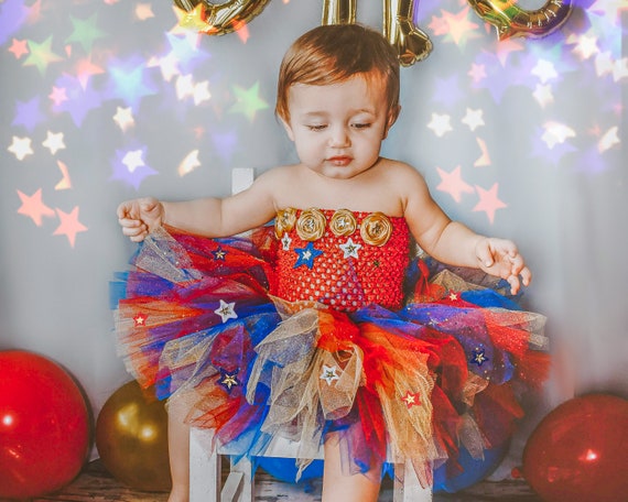 Wonder woman tutu top outfit, baby girl cake smash birthday photos, glitter blue tulle dress, stars, July Fourth 4th, Summer Party, full