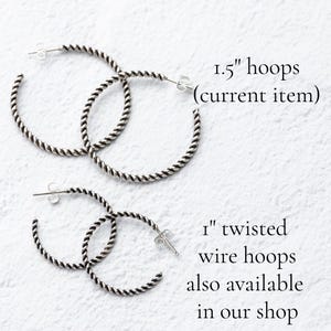 May include: Two pairs of silver-colored twisted wire hoop earrings. The top pair is 1.5 inches in diameter, and the bottom pair is 1 inch. Text on the image says "1.5" hoops (current item)" and "1" twisted wire hoops also available in our shop."