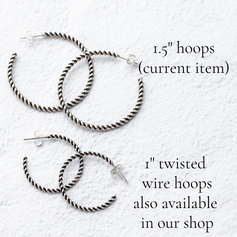 May include: Two pairs of silver-colored twisted wire hoop earrings. The top pair is 1.5 inches in diameter, and the bottom pair is 1 inch. Text on the image says "1.5" hoops (current item)" and "1" twisted wire hoops also available in our shop."