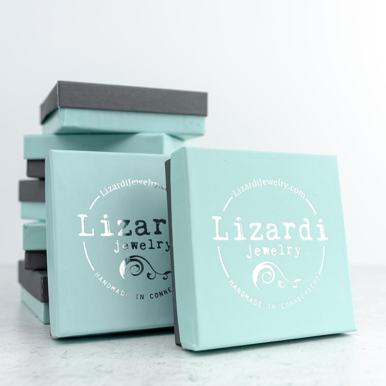 This photo shows a stack of our branded Lizardi jewelry gift boxes which are included with every item so our jewelry is the perfect gift for her.