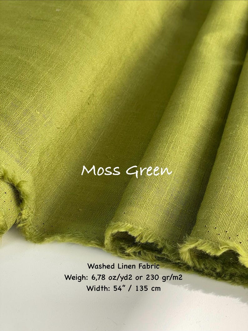 May include: A bolt of moss green washed linen fabric with a visible weave texture. The text on the fabric reads Moss Green, Washed Linen Fabric, Weigh: 6.78 oz/yd2, and Width: 54 inches. The fabric has frayed edges and is folded in layers.