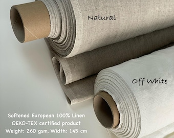 May include: Three rolls of linen fabric in natural, off-white, and a darker neutral color. The natural roll is labeled "Natural", and the off-white roll is labeled "off white". The fabric is 145 cm wide and weighs 260 gsm.