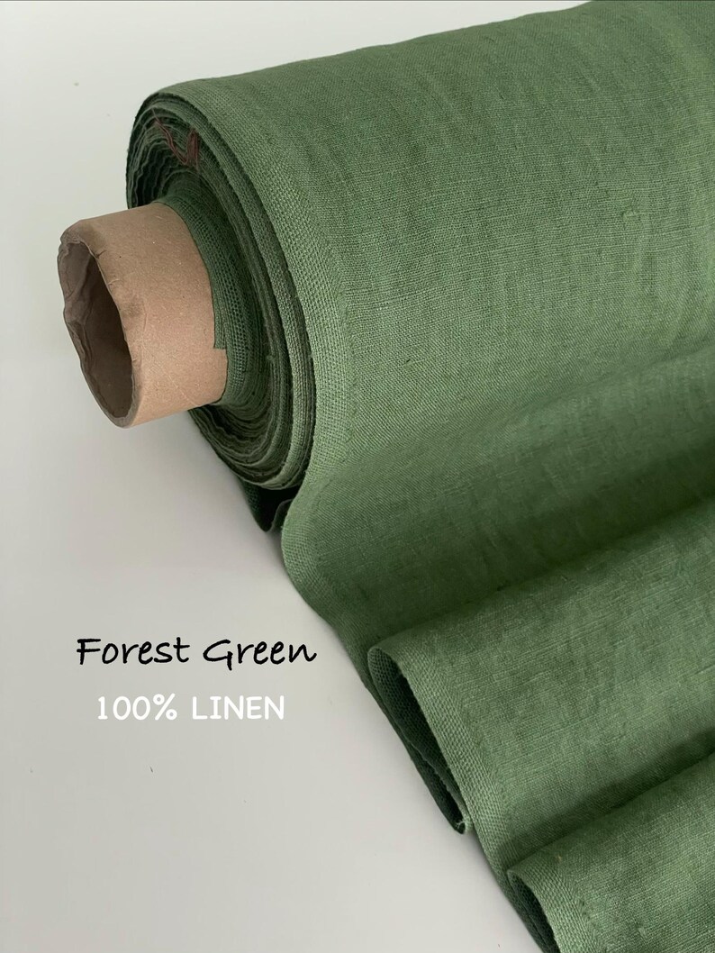 May include: A roll of forest green fabric made of 100% linen. The textile features a visible woven texture and is wrapped around a cardboard core. The text Forest Green 100% LINEN is printed on the left side of the image in a simple font.
