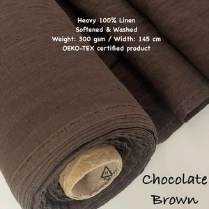 May include: A roll of chocolate brown heavy 100% linen fabric. The fabric is softened and washed, with a weight of 300 gsm and a width of 145 cm. The text "Chocolate Brown" is visible on the image. The product is OEKO-TEX certified.