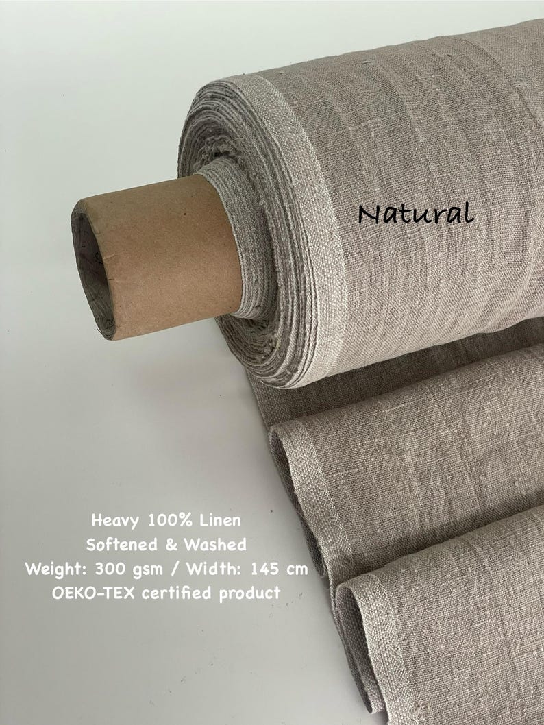 May include: A roll of natural-colored, heavy 100% linen fabric. The fabric is softened and washed, with a width of 57 inches. The text "Natural" is visible on the fabric. The product is OEKO-TEX certified.
