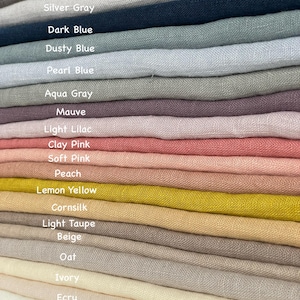 May include: A stack of fabric swatches in various colors, including black, steel gray, silver gray, dark blue, dusty blue, pearl blue, aqua gray, mauve, light lilac, clay pink, soft pink, peach, lemon yellow, cornsilk, light taupe, beige, oat, ivory, ecru, off white, and optical white.