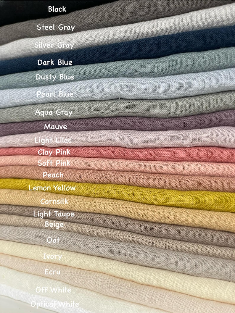 May include: A stack of fabric swatches in various colors, including black, steel gray, silver gray, dark blue, dusty blue, pearl blue, aqua gray, mauve, light lilac, clay pink, soft pink, peach, lemon yellow, cornsilk, light taupe, beige, oat, ivory, ecru, off white, and optical white.