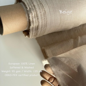 May include: A roll of beige European 100% linen fabric. The fabric is softened and washed, with a width of 53 inches. The text "Beige" is visible on the fabric. The product is an OEKO-TEX certified product.