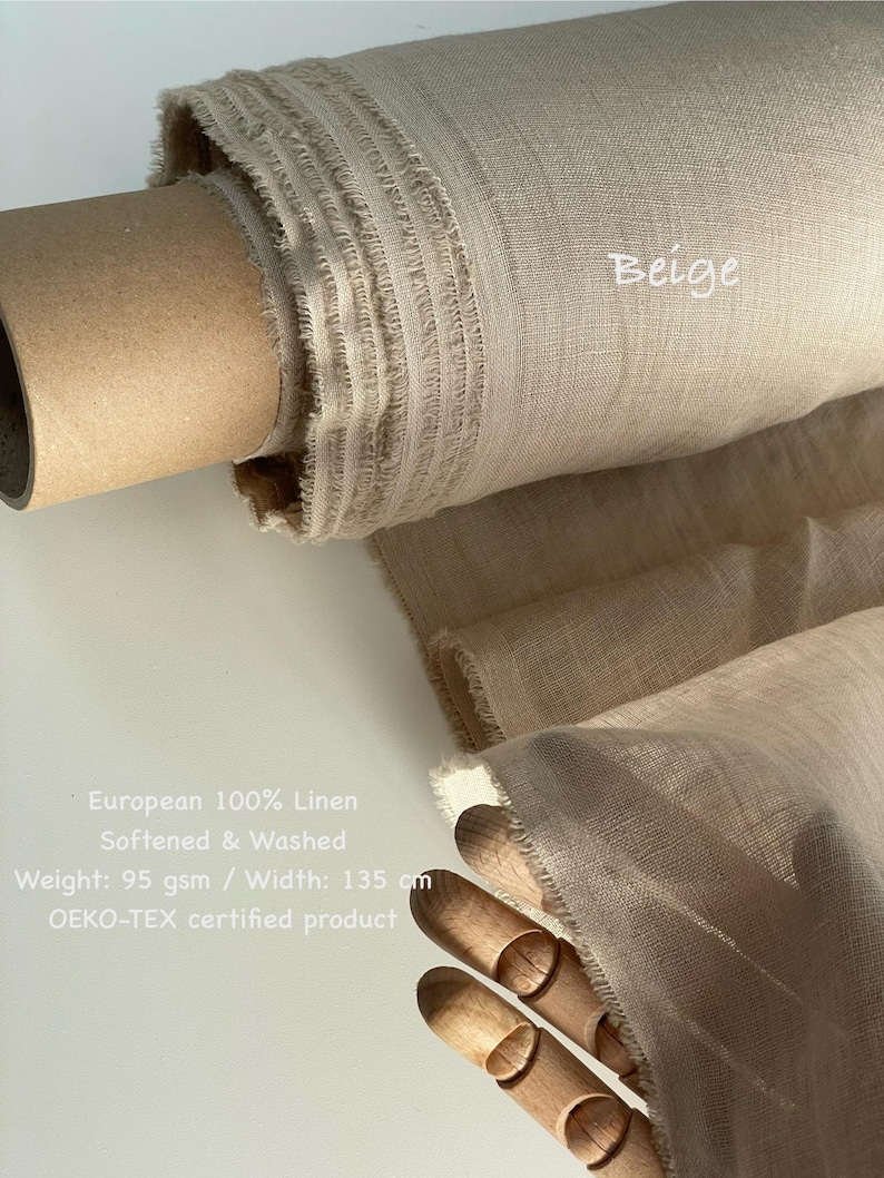 May include: A roll of beige European 100% linen fabric. The fabric is softened and washed, with a width of 53 inches. The text "Beige" is visible on the fabric. The product is an OEKO-TEX certified product.