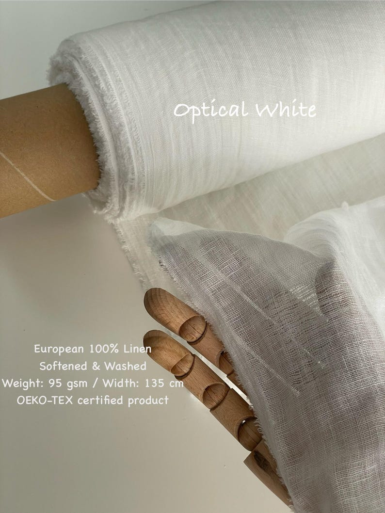 May include: A roll of optical white European 100% linen fabric. The fabric is softened, washed, and has a weight of 95 gsm. The width of the fabric is 135 cm. The fabric is OEKO-TEX certified.