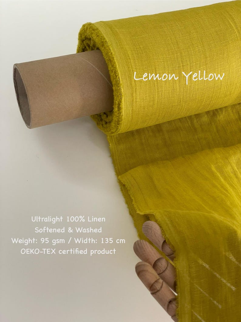May include: A roll of lemon yellow ultralight 100% linen fabric. The fabric is softened and washed, with a width of 53 inches. The text "Lemon Yellow" is written on the fabric. The fabric is an OEKO-TEX certified product.