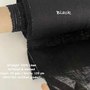 May include: A roll of black ultralight 100% linen fabric. The fabric is softened and washed, with a weight of 95 gsm and a width of 135 cm. The text "Black" is visible on the fabric. The product is OEKO-TEX certified.