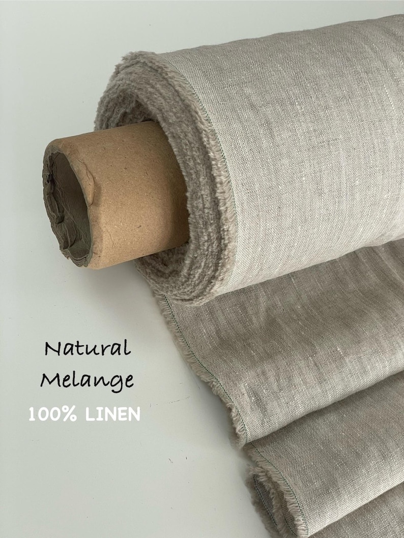 May include: A roll of natural melange 100% linen fabric with a visible woven texture and frayed edges. The fabric is wrapped around a brown cardboard tube. The text Natural Melange 100% LINEN is printed on the left side of the image.